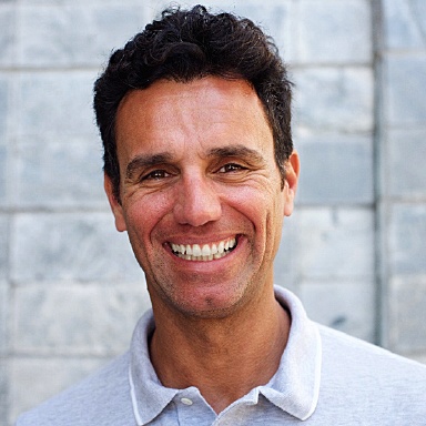 Smiling man with perfect teeth from best Long Island dental implant dentist, Dr. Allan Mohr
