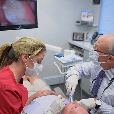 Dentist capturing intraoral photos