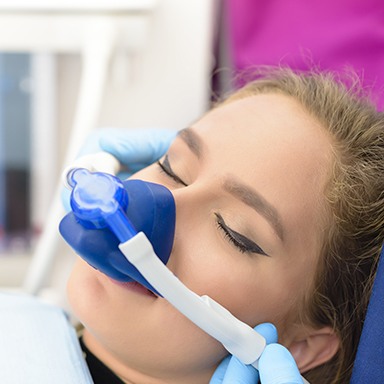 Woman with nitrous oxide nasal mask