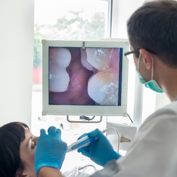 Dentist capturing close up photos of a patients teeth