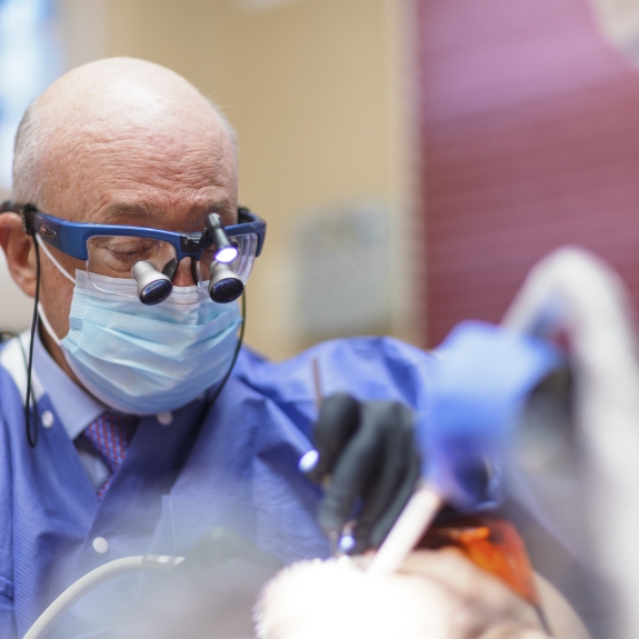 Doctor Mohr examining a patients teeth
