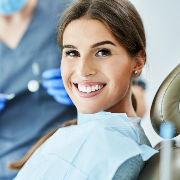 Brunette woman smiling in the dental chair