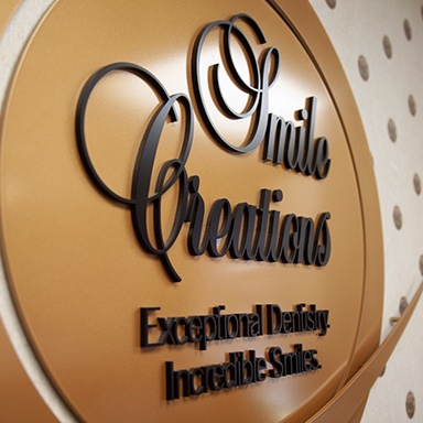 Smile Creations reception room sign for Massapequa Park dental implant dentist, Dr. Allan Mohr