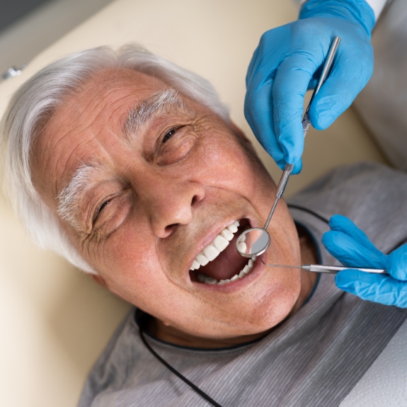 Senior man receiving a dental exam