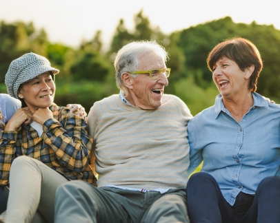 Group of adults laughing together outdoors