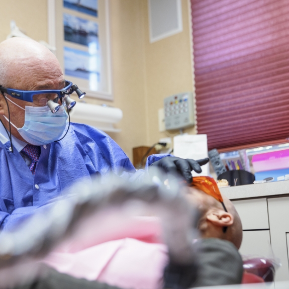 Doctor Mohr performing periodontal maintenance on a patient
