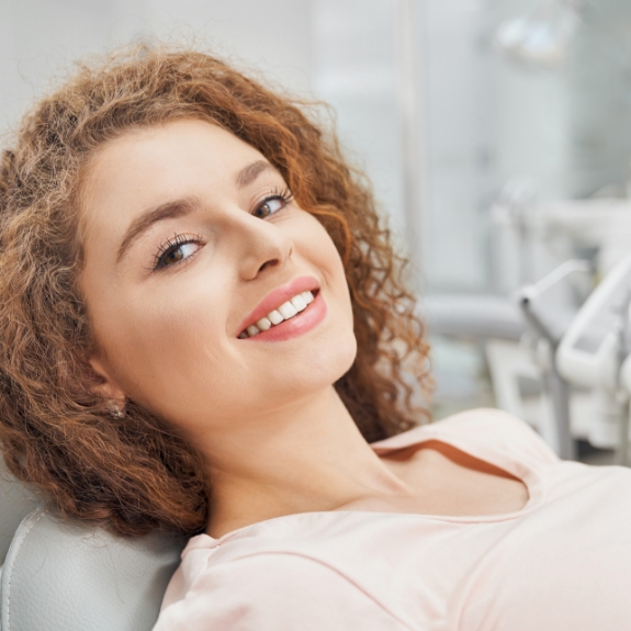 Young woman smiling in the dental chair