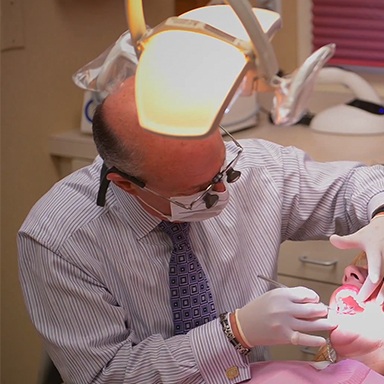 Dr. Allan Mohr working on a patient with dental implants