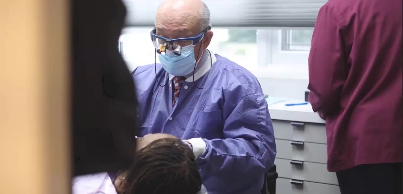 Massapequa Park cosmetic dentist Doctor Allan Mohr treating a patient