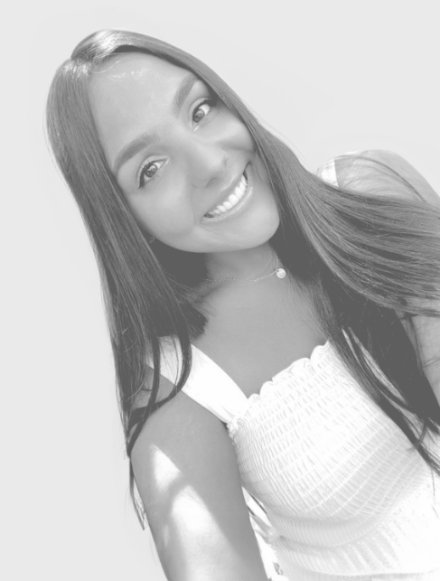 Selfie of a young woman with long straight hair and flawless teeth