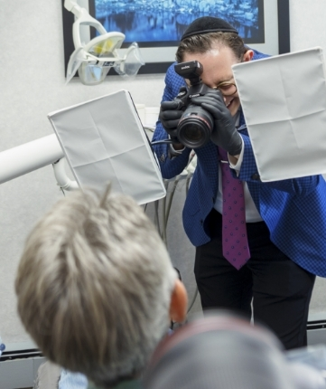 Dental patient having her smile photographed by Doctor Ariel