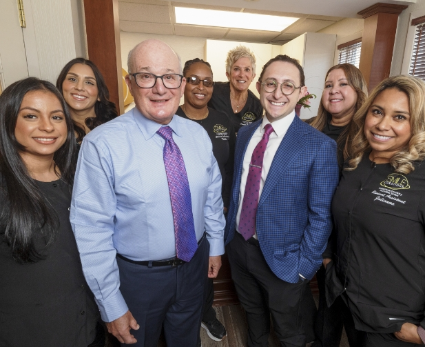 Group photo of the Massapequa Park dentists and team members at Smile Creations