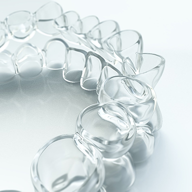 two Invisalign trays sitting on one another