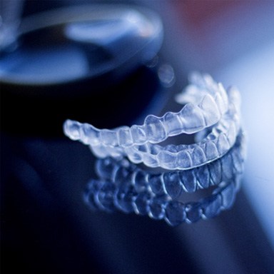 Invisalign tray sitting on table 