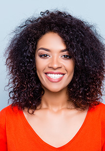 Woman with beautiful teeth smiling in Long Island