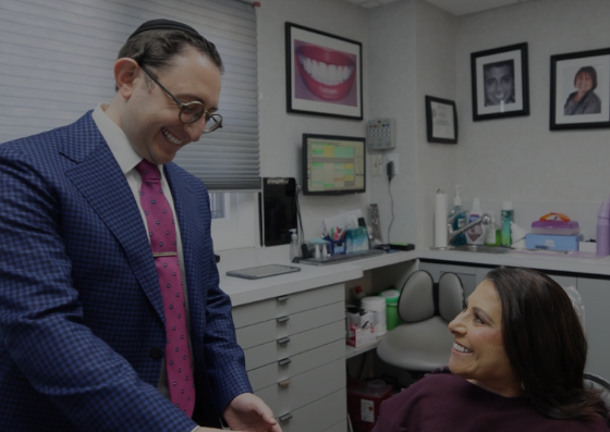 Smiling dental patient checking out
