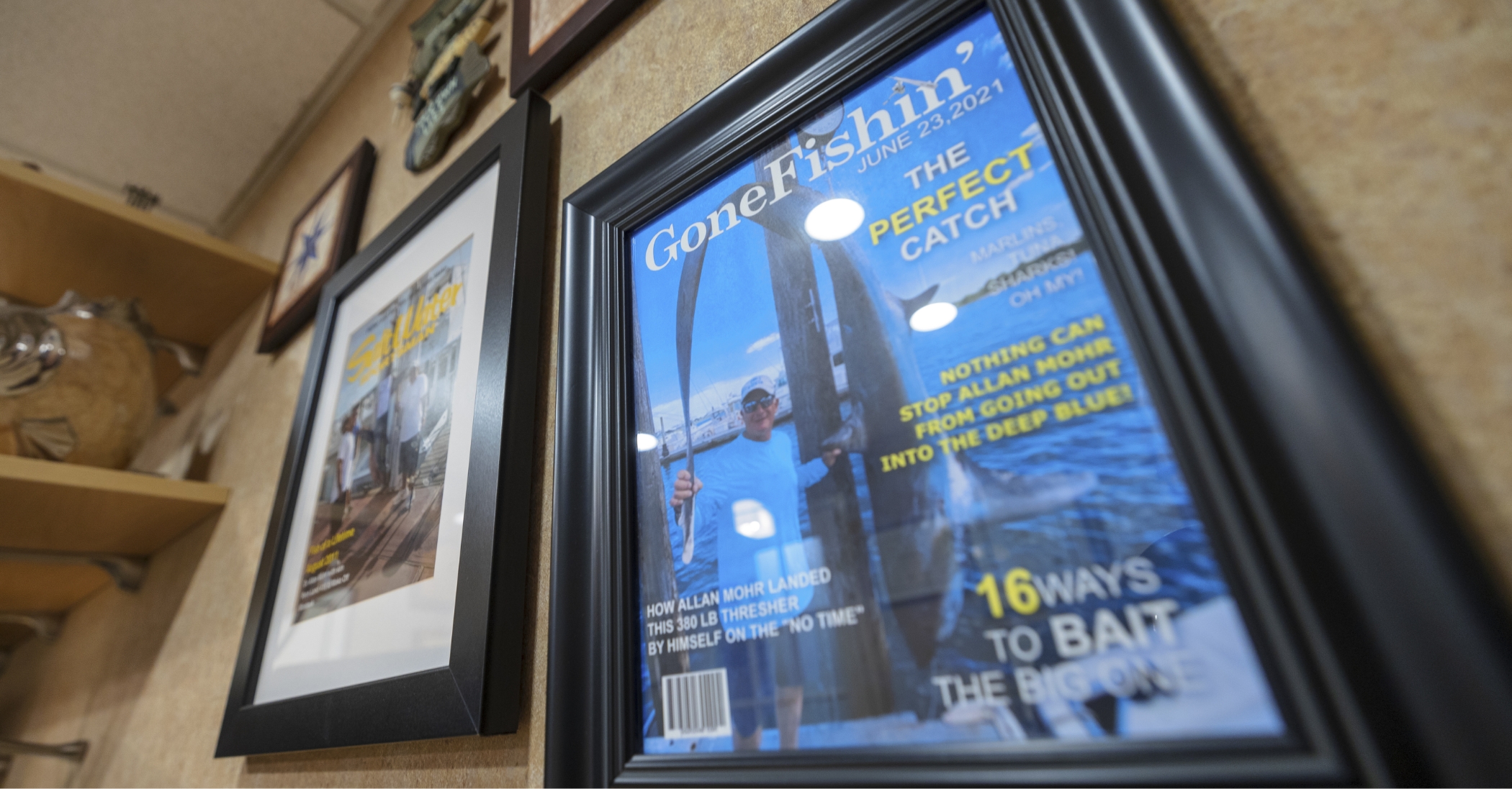 Framed cover of Gone Fishin Magazine with Doctor Mohr holding a large fish on a boat