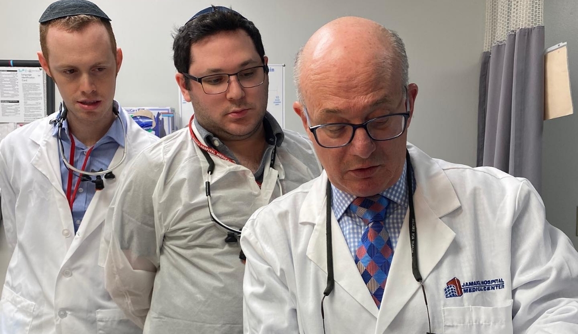 Doctor Mohr mentoring two other dentists