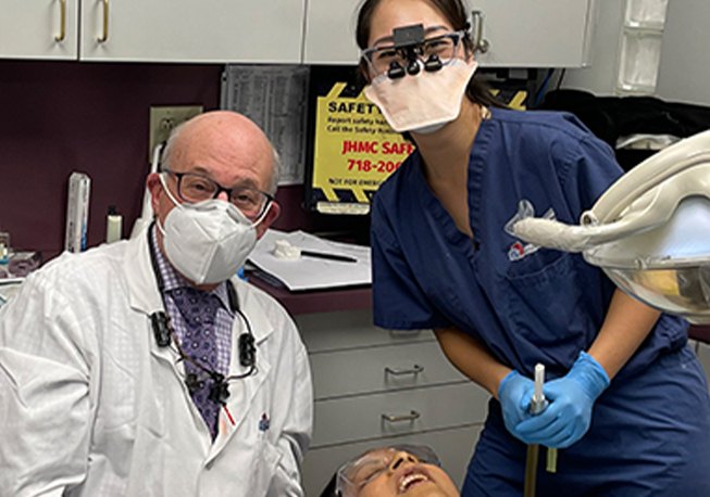 Dr. Mohr and female dental team member with masks