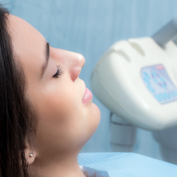 Woman with her eyes closed in the dental chair