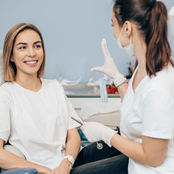 Smiling woman listening to her dentist