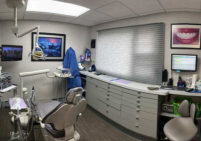 Back shot of dental chair in treatment area