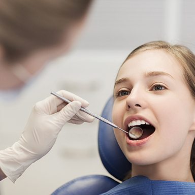 Child reciving dental checkup