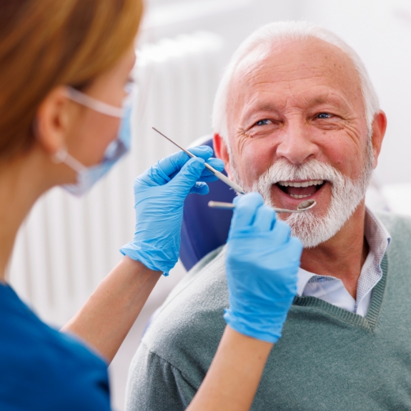 Senior man smiling at his dentist