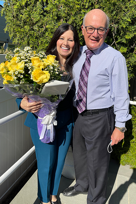 Alice smiling with Dr. Allan Mohr after best veneers and Invisalign braces