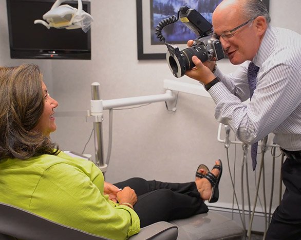 Massapequa Park cosmetic dentist taking patient's photo