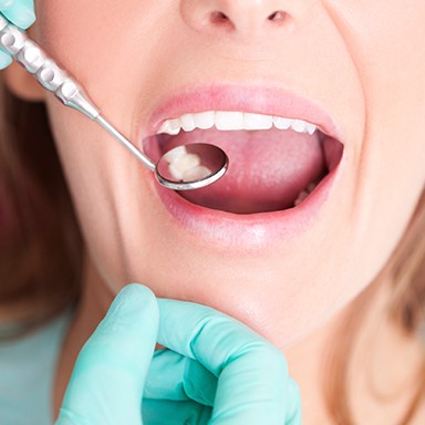 Woman receiving dental exam