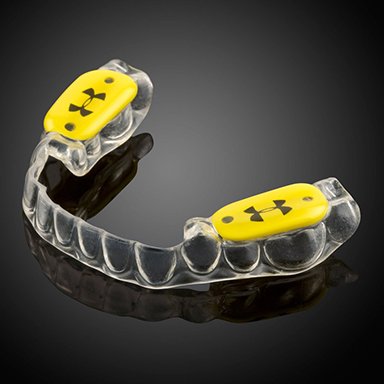 Under Armour mouthguard on table