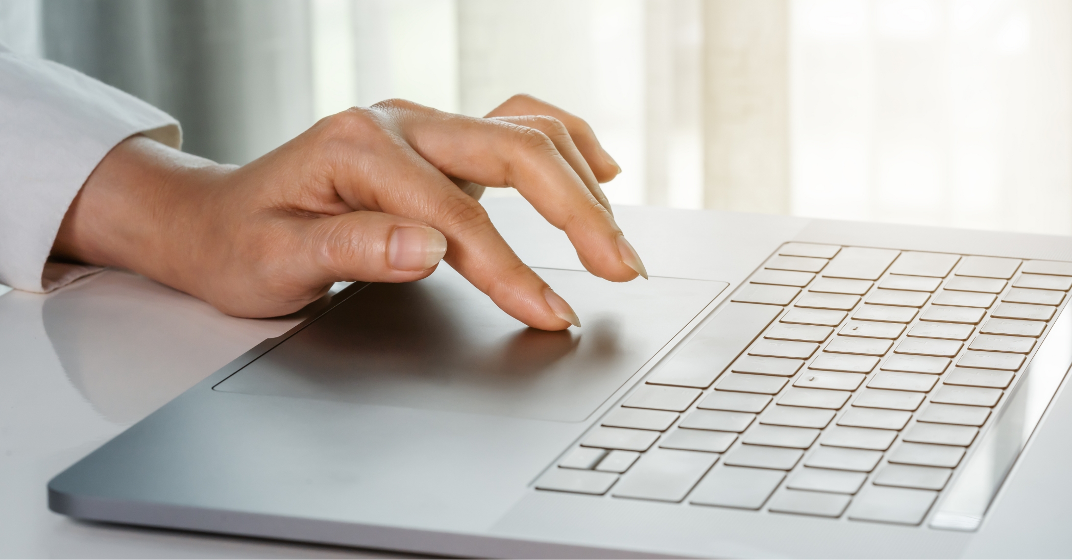 CLose up of hands using a laptop