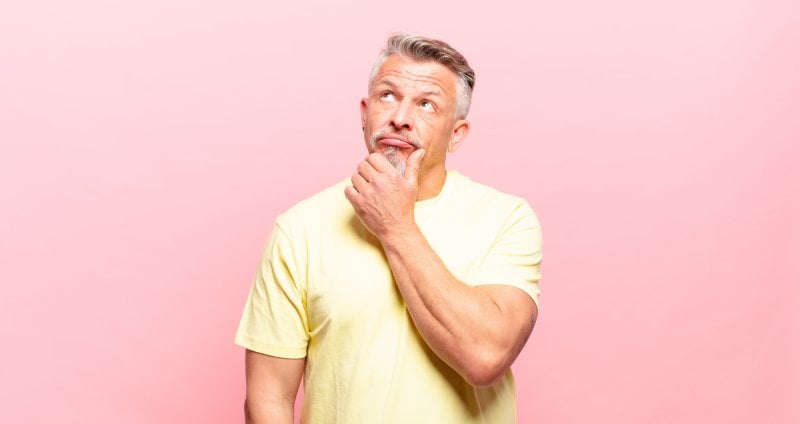 older man wondering about dental implants