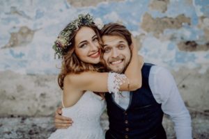 young bride and groom smiling 