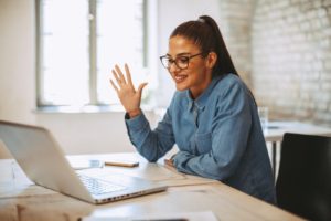 woman smiling during virtual job interview 