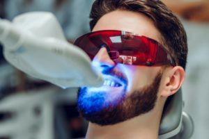 man receiving best Long Island teeth whitening   