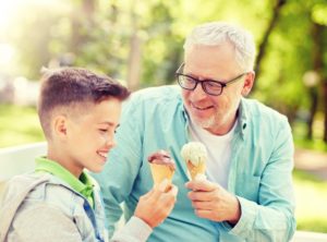 grandpa eating ice cream with grandson