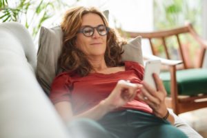 middle-aged woman relaxing on the couch 