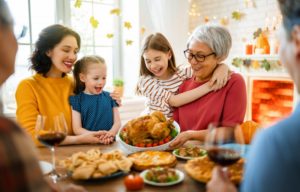 older woman with family at thanksgiving 