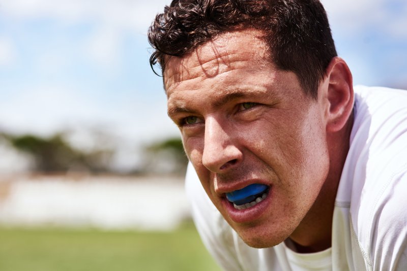 man wearing mouthguard on field