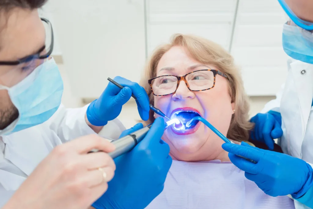 Dentist curing dental crowns in Massapequa.