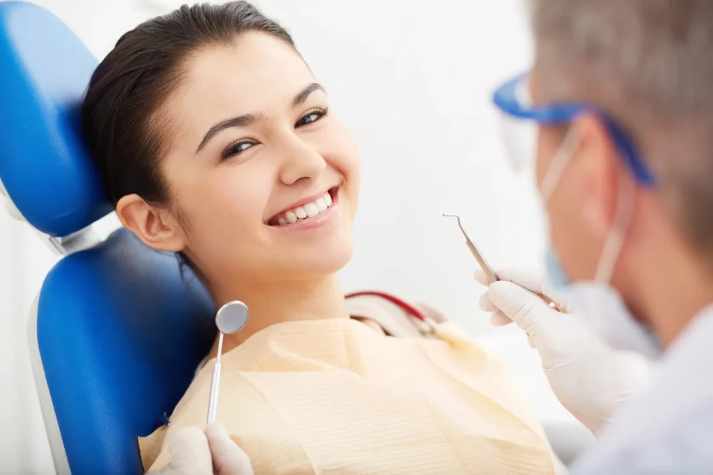 Happy patient after full mouth reconstruction Long Island